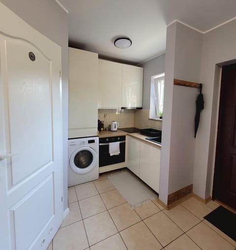 Kitchen or kitchenette, stove, washing machine