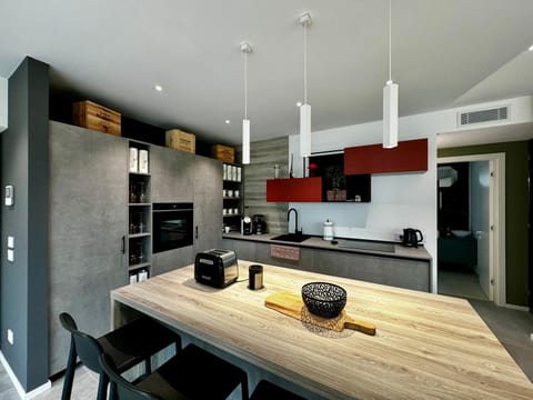 Kitchen or kitchenette, dishwasher, stove, toaster