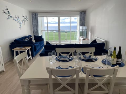 Golfcourse, View (from property/room), Living room, Seating area, Dining area, Sea view