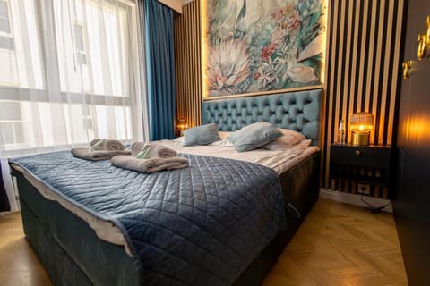 Bed, Photo of the whole room, Bedroom, flat iron, hair dryier, towels, wardrobe, washing machine, dryer