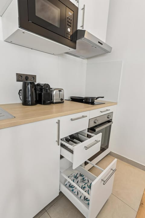 Kitchen or kitchenette, stove, toaster