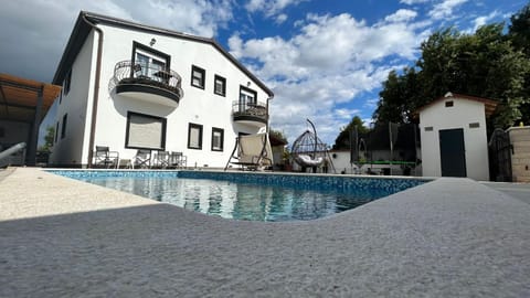 Property building, Patio, Day, Pool view, Swimming pool