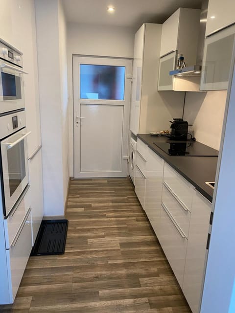 Kitchen or kitchenette, dishwasher, oven, stove, toaster