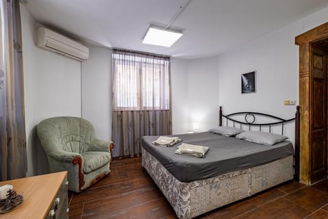 Photo of the whole room, Bedroom, towels, air conditioner