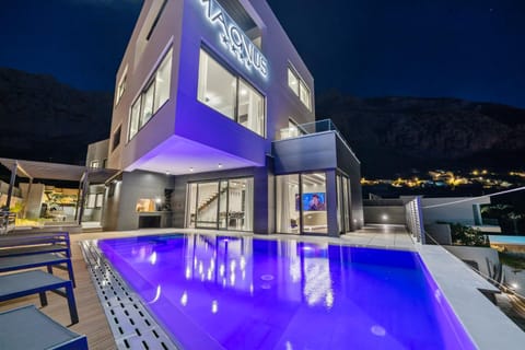 Property building, Patio, Night, Natural landscape, Mountain view, Pool view, Swimming pool, sunbed