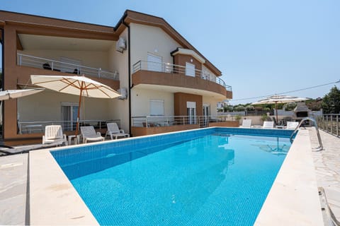 Property building, Pool view, Swimming pool, sunbed
