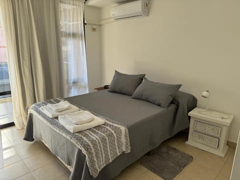Bed, Photo of the whole room, Bedroom, towels, air conditioner