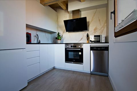 Kitchen or kitchenette, dishwasher, oven, stove, toaster