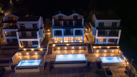 Property building, Patio, Night, Pool view, Swimming pool, Swimming pool, sunbed