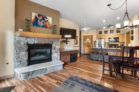 TV and multimedia, Kitchen or kitchenette, Living room, Seating area, Dining area, fireplace, furniture, microwave, oven, stove, toaster