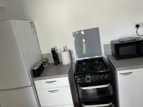 Kitchen or kitchenette, oven, stove