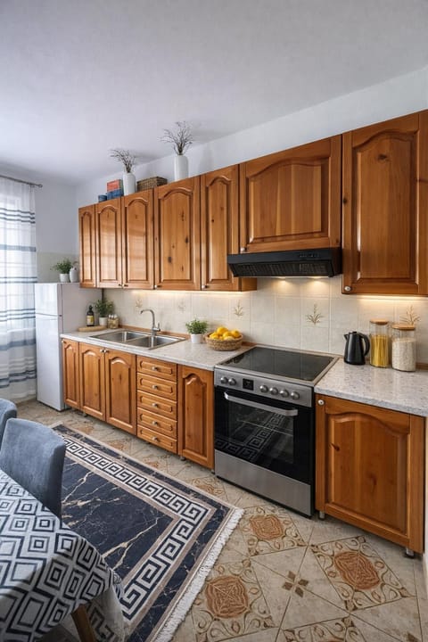 Kitchen or kitchenette, dishwasher, oven, stove