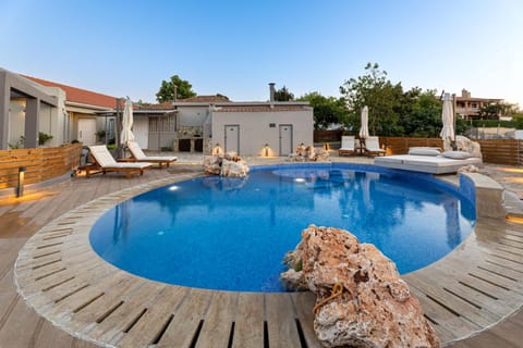 Property building, Day, Natural landscape, Pool view, Swimming pool, Swimming pool, sunbed