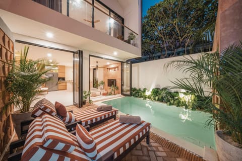 Property building, Patio, Night, Garden, View (from property/room), Balcony/Terrace, Living room, Seating area, Garden view, Pool view, Swimming pool, sunbed