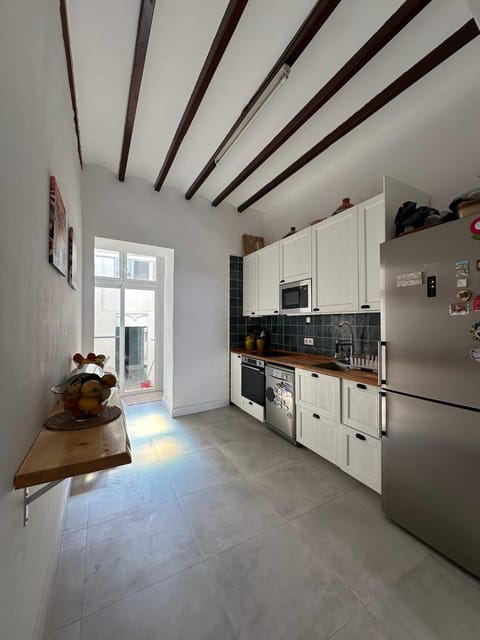 Kitchen or kitchenette, dishwasher, oven, stove