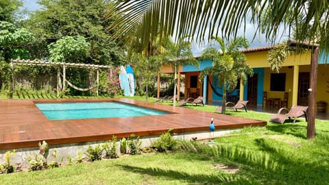 Property building, Garden, Pool view, Swimming pool, sunbed