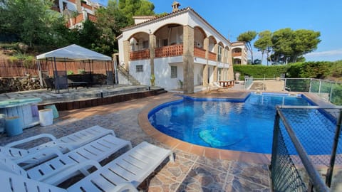 Property building, Patio, Natural landscape, Swimming pool