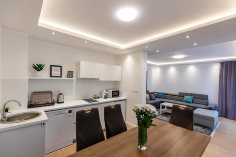 Kitchen or kitchenette, Living room, dishwasher, microwave, stove, air conditioner