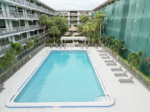 Property building, Pool view, Swimming pool, sunbed