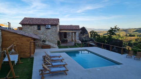 Property building, Patio, Natural landscape, Pool view, Swimming pool, sunbed