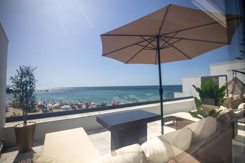 View (from property/room), Balcony/Terrace, Seating area, Beach, sunbed