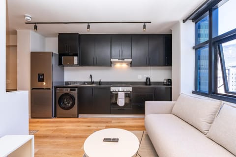 Kitchen or kitchenette, Living room, Seating area, washing machine