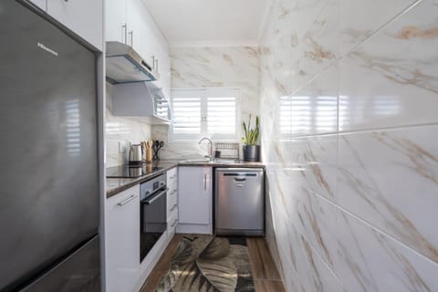 Kitchen or kitchenette, dishwasher, oven, stove, toaster