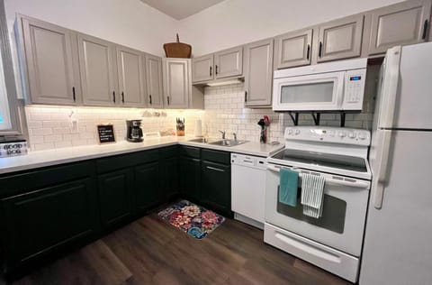 Kitchen or kitchenette, dishwasher, microwave, oven, stove, toaster