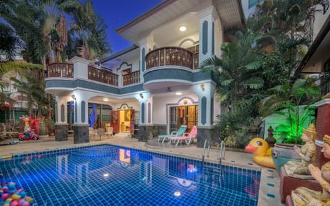 Property building, Patio, Night, Pool view, Swimming pool