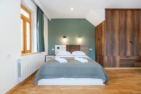 Bed, towels, wardrobe