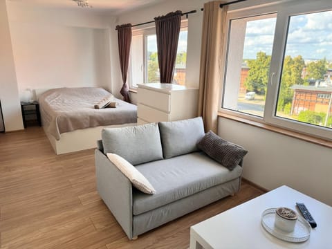 Bed, View (from property/room), Living room, Seating area, Bedroom