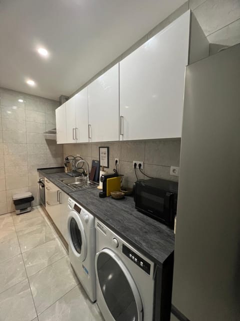 Kitchen or kitchenette, oven, stove, washing machine, dryer