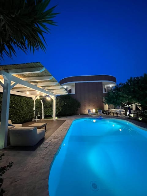 Property building, Patio, Night, Pool view, Swimming pool, sunbed