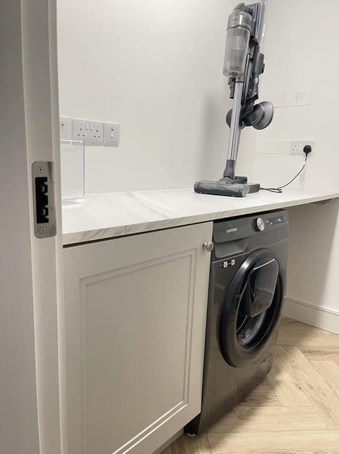 Kitchen or kitchenette, washing machine