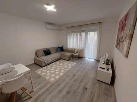 Bed, TV and multimedia, Living room, Seating area, air conditioner