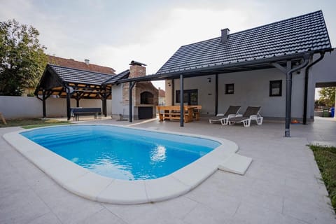 Property building, Patio, Day, Pool view, sunbed