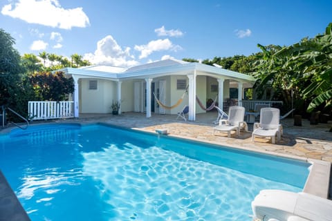 Property building, Patio, Day, Natural landscape, Garden, Garden view, Pool view, Swimming pool, sunbed