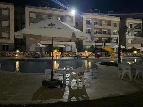 Property building, Patio, Night, Pool view, Swimming pool, sunbed