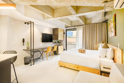 Bed, TV and multimedia, Living room, Seating area, Bedroom, air conditioner