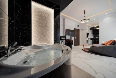Bed, Hot Tub, Bathroom, Living room, Photo of the whole room, Seating area, Bedroom, Bath