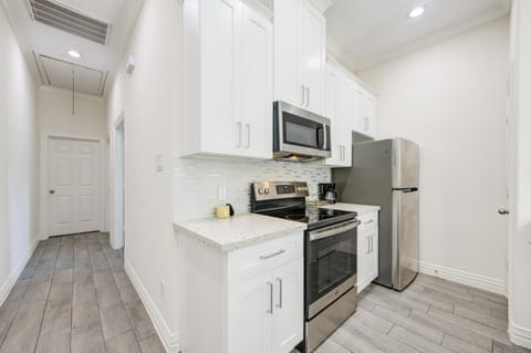 Kitchen or kitchenette, dishwasher, oven, stove, toaster