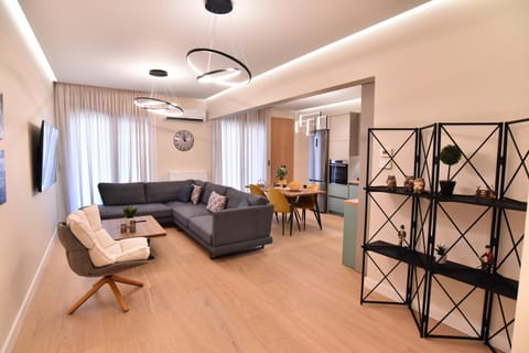 Property building, TV and multimedia, Living room, Seating area, City view, Mountain view, kitchen