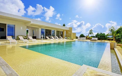 Property building, Patio, Pool view, Swimming pool, sunbed