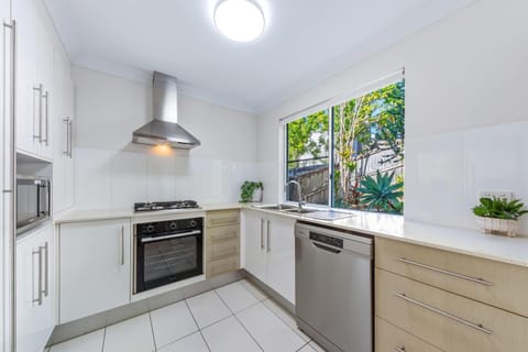 Kitchen or kitchenette, dishwasher, oven, stove