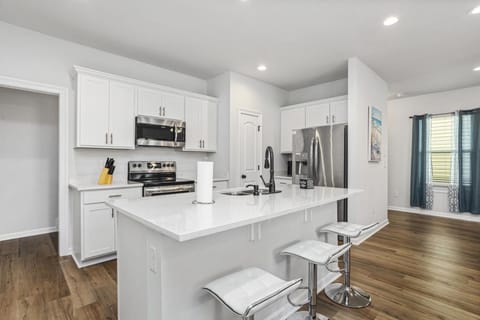 Kitchen or kitchenette, dishwasher, oven, stove