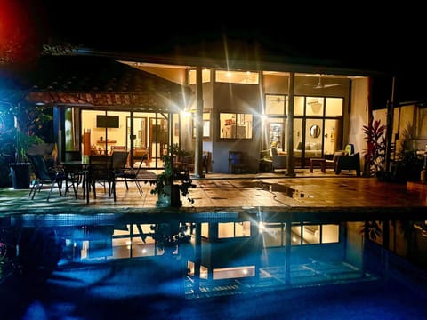 Property building, Patio, Night, Pool view, Swimming pool