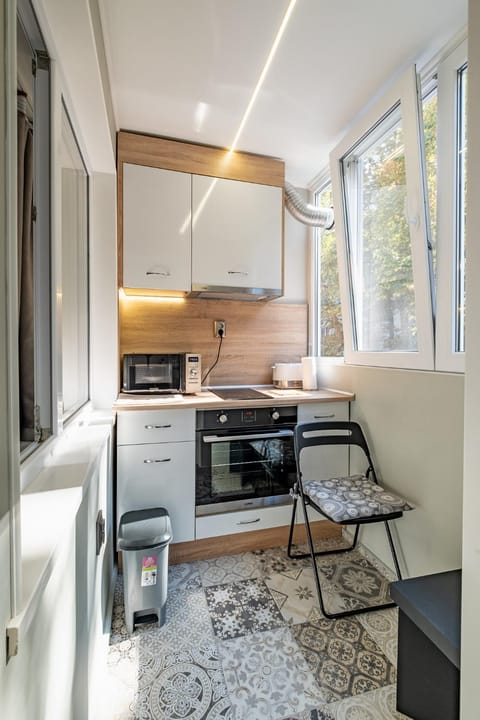 Kitchen or kitchenette, microwave, oven, stove, toaster