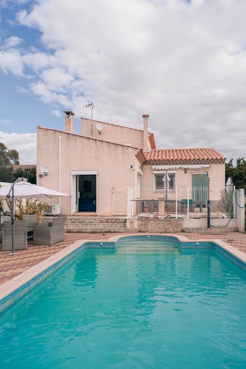 Property building, Patio, Pool view, Swimming pool, sunbed