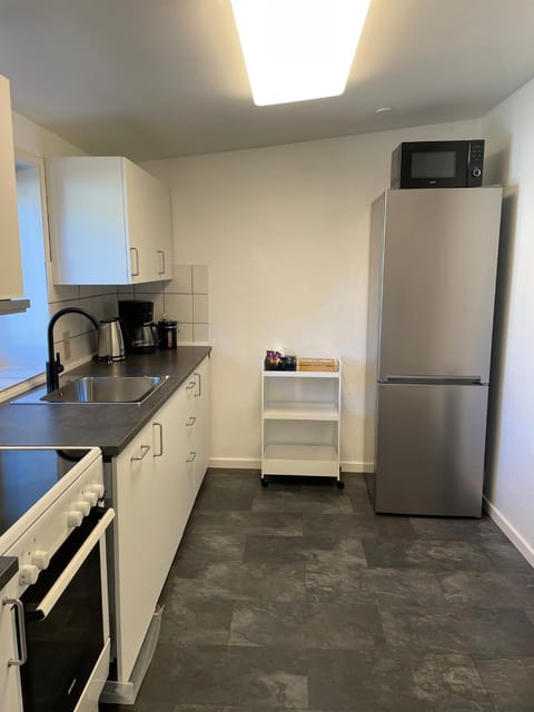 Kitchen or kitchenette, dishwasher, oven, stove