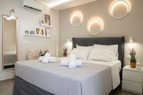 Bed, Decorative detail, Seating area, Bedroom, towels, air conditioner